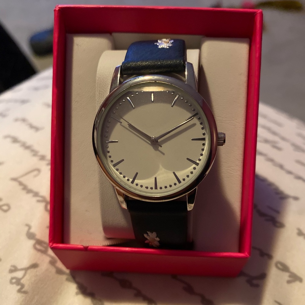 navy blue watch with flowers on the band